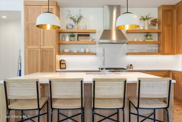 428 W Beach Ct, Dover, ID 83825 - kitchen featuring wall chimney exhaust hood, open shelves, tasteful backsplash, and light countertops