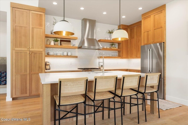 428 W Beach Ct, Dover, ID 83825 - kitchen featuring high end fridge, open shelves, wall chimney exhaust hood, light wood-style floors, and light countertops