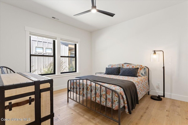 428 W Beach Ct, Dover, ID 83825 - bedroom with light wood-style flooring and a ceiling fan