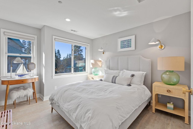 4732 S Arrow Point Dr # 304, Harrison, ID 83833 - bedroom with wood finished floors and recessed lighting