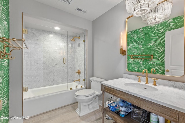 4732 S Arrow Point Dr # 304, Harrison, ID 83833 - bathroom featuring enclosed tub / shower combo, wood finished floors, vanity, and a chandelier