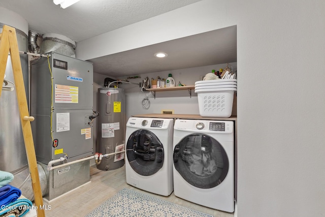 4732 S Arrow Point Dr # 304, Harrison, ID 83833 - laundry area featuring water heater, washer and dryer, wood finished floors, and heating unit