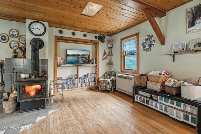 854 Two Tail Rd, Bonners Ferry, ID 83805 - sitting room with wooden ceiling, a wood stove, and hardwood / wood-style floors