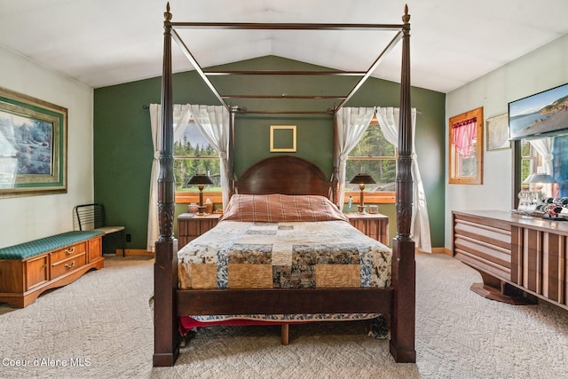 854 Two Tail Rd, Bonners Ferry, ID 83805 - bedroom with light carpet, multiple windows, and lofted ceiling