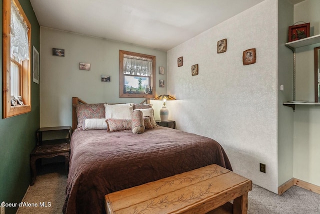 854 Two Tail Rd, Bonners Ferry, ID 83805 - bedroom with light carpet and baseboards
