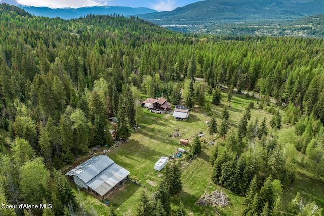 854 Two Tail Rd, Bonners Ferry, ID 83805 - aerial view of property and surrounding area with a heavily wooded area and a mountainous background
