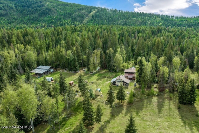 854 Two Tail Rd, Bonners Ferry, ID 83805 - view from above of property featuring a forest and a mountain backdrop