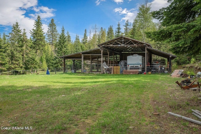 854 Two Tail Rd, Bonners Ferry, ID 83805 - view of yard with an exterior structure, an outdoor structure, and a detached carport