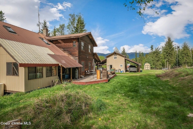 854 Two Tail Rd, Bonners Ferry, ID 83805 - view of grassy yard featuring a shed and a deck