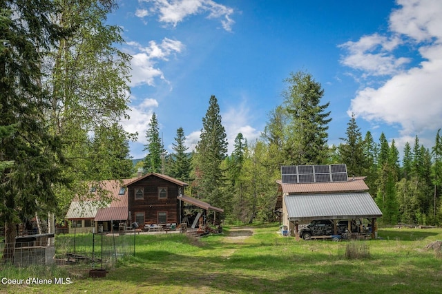 854 Two Tail Rd, Bonners Ferry, ID 83805 - view of grassy yard featuring a wooded view and an outdoor structure
