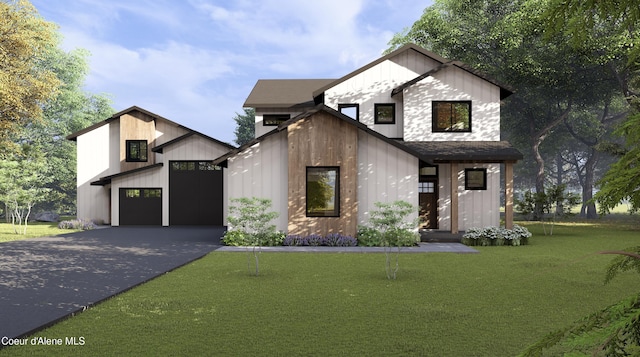 2442 W Okanogan Ave, Post Falls, ID 83854 - modern inspired farmhouse featuring a garage, an outdoor structure, asphalt driveway, and a front lawn