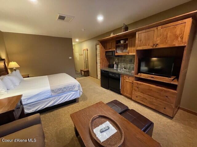150 Morning Star Dr Unit 379, Kellogg, ID 83837 - bedroom featuring light carpet and recessed lighting