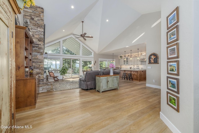 16749 W Cade Rd, Hauser, ID 83854 - living room with ceiling fan, high vaulted ceiling, light wood finished floors, and recessed lighting