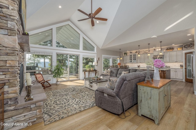16749 W Cade Rd, Hauser, ID 83854 - living area with ceiling fan, high vaulted ceiling, light wood-style floors, and recessed lighting