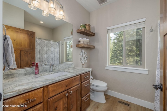 16749 W Cade Rd, Hauser, ID 83854 - bathroom with vanity and wood finished floors