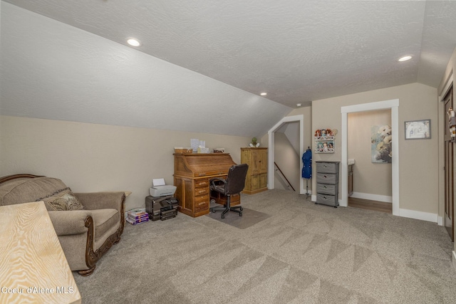 16749 W Cade Rd, Hauser, ID 83854 - office space with vaulted ceiling, light colored carpet, recessed lighting, and a textured ceiling