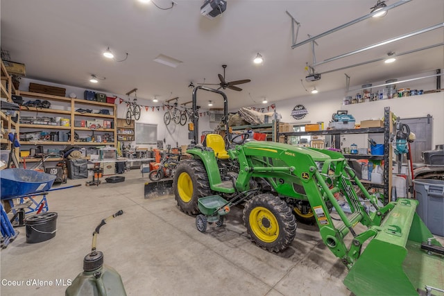 16749 W Cade Rd, Hauser, ID 83854 - garage featuring a garage door opener and a ceiling fan