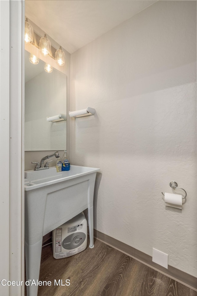 16749 W Cade Rd, Hauser, ID 83854 - bathroom with wood finished floors and baseboards