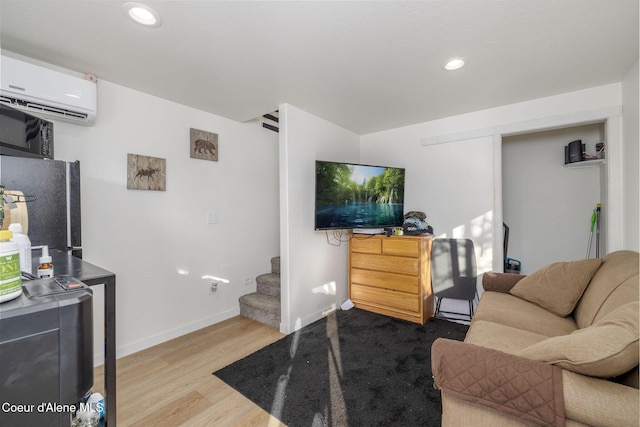 16749 W Cade Rd, Hauser, ID 83854 - living area with a wall mounted AC, stairs, wood finished floors, and recessed lighting