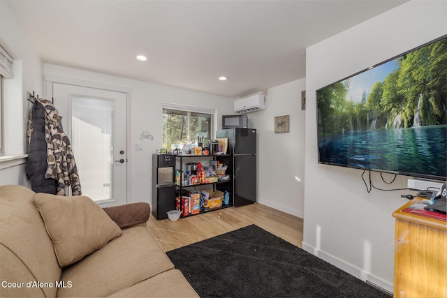16749 W Cade Rd, Hauser, ID 83854 - living area with a wall mounted AC, wood finished floors, and recessed lighting