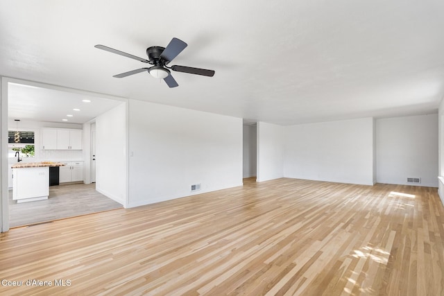 170 10th St, Priest River, ID 83856 - unfurnished living room with light wood-type flooring, ceiling fan, and recessed lighting