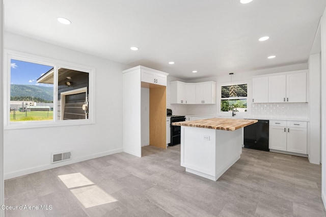 170 10th St, Priest River, ID 83856 - kitchen featuring dishwasher, butcher block countertops, range, tasteful backsplash, and white cabinets