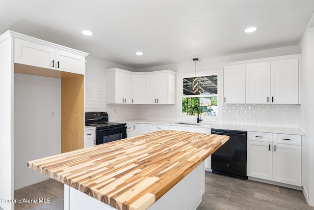 170 10th St, Priest River, ID 83856 - kitchen featuring black appliances, wood counters, white cabinets, a kitchen island, and backsplash