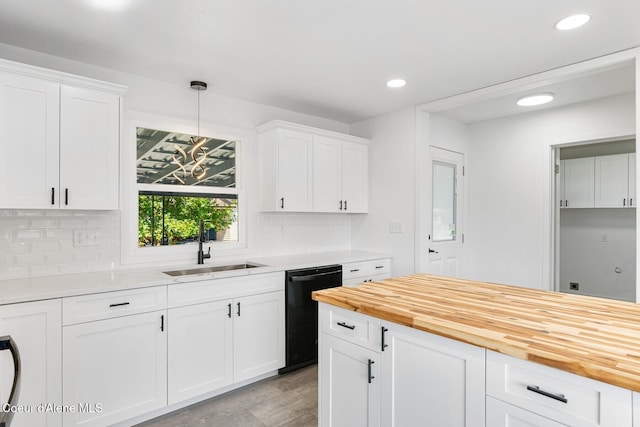 170 10th St, Priest River, ID 83856 - kitchen with black dishwasher, wood counters, tasteful backsplash, recessed lighting, and white cabinetry