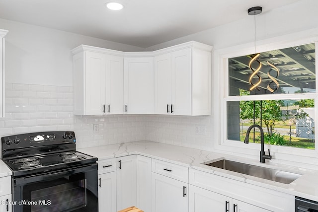 170 10th St, Priest River, ID 83856 - kitchen with electric range, white cabinetry, backsplash, light stone countertops, and recessed lighting