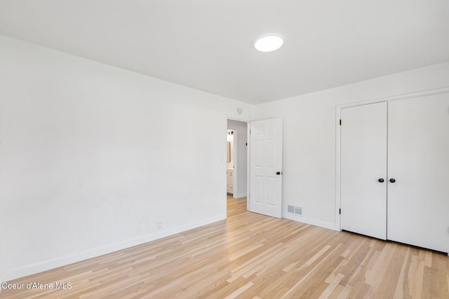 170 10th St, Priest River, ID 83856 - unfurnished bedroom featuring light wood-style floors and a closet