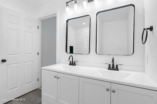 170 10th St, Priest River, ID 83856 - bathroom featuring double vanity and finished concrete floors
