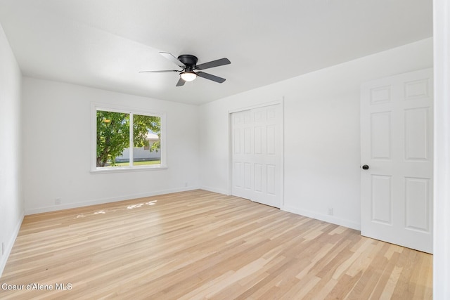 170 10th St, Priest River, ID 83856 - unfurnished bedroom featuring light wood finished floors, a closet, and a ceiling fan