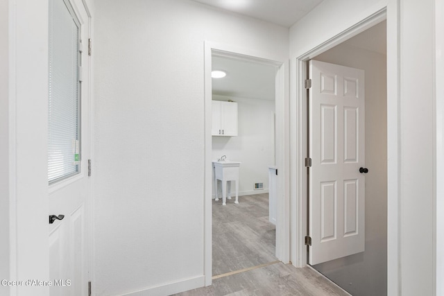 170 10th St, Priest River, ID 83856 - corridor with light wood-style floors and a sink