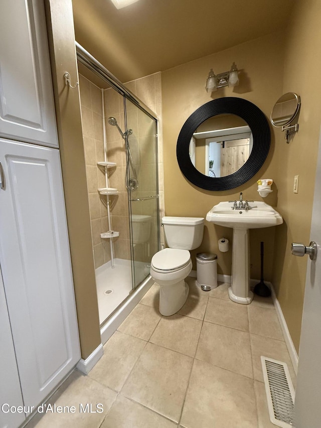 912 N 5th St, Coeur Dalene, ID 83814 - full bath featuring a stall shower and tile patterned floors