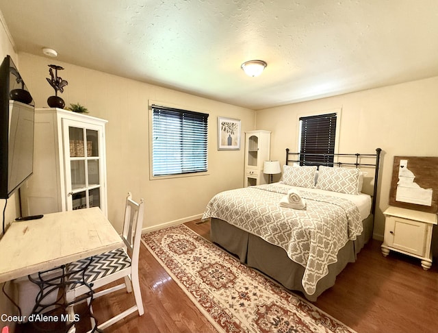 912 N 5th St, Coeur Dalene, ID 83814 - bedroom featuring dark wood finished floors