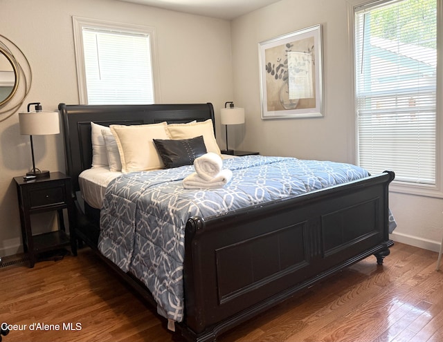 912 N 5th St, Coeur Dalene, ID 83814 - bedroom featuring wood finished floors and baseboards