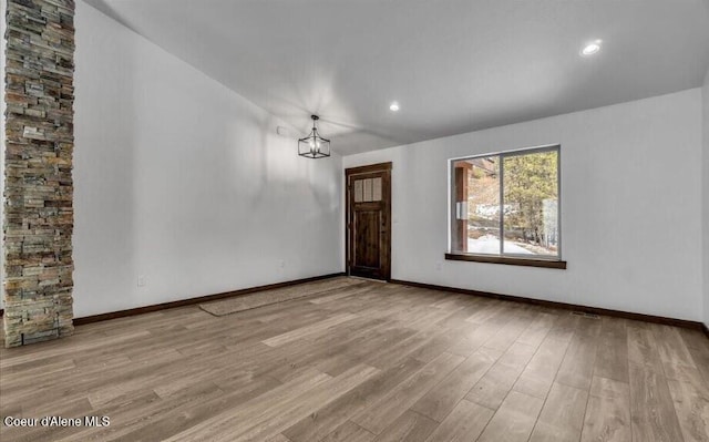 116 Prospector Lp, Kellogg, ID 83837 - empty room featuring wood finished floors, a chandelier, and recessed lighting