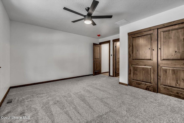 116 Prospector Lp, Kellogg, ID 83837 - unfurnished bedroom with carpet, ceiling fan, a textured ceiling, and a closet