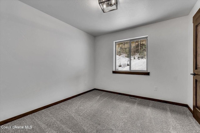 116 Prospector Lp, Kellogg, ID 83837 - spare room featuring carpet and baseboards
