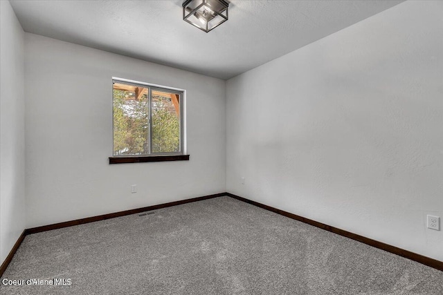 116 Prospector Lp, Kellogg, ID 83837 - empty room featuring carpet floors and baseboards