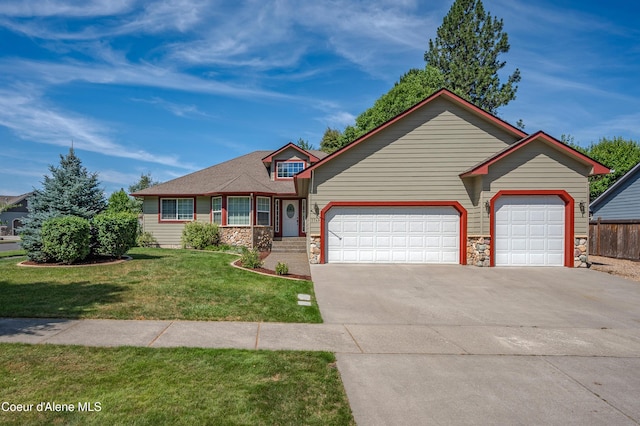 3749 N Miners Loop, Coeur Dalene, ID 83815 - view of front of property with stone siding, an attached garage, a front lawn, and concrete driveway