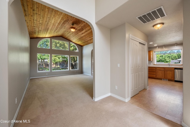 3749 N Miners Loop, Coeur Dalene, ID 83815 - hall featuring arched walkways, wood ceiling, light carpet, and vaulted ceiling