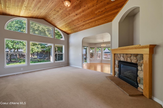 3749 N Miners Loop, Coeur Dalene, ID 83815 - unfurnished living room with wooden ceiling, carpet floors, a chandelier, a fireplace, and high vaulted ceiling