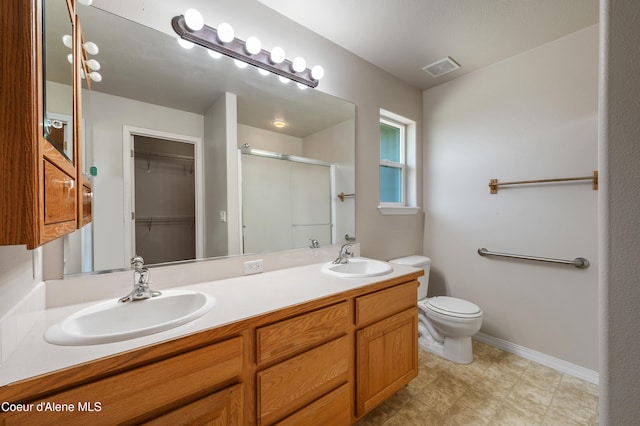 3749 N Miners Loop, Coeur Dalene, ID 83815 - bathroom with a shower stall, double vanity, a walk in closet, and tile patterned floors