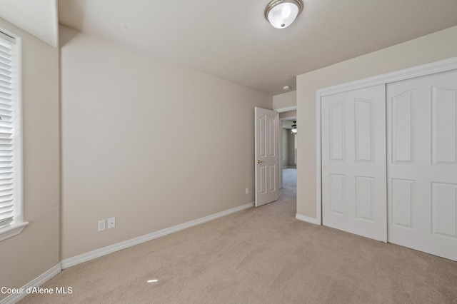 3749 N Miners Loop, Coeur Dalene, ID 83815 - unfurnished bedroom with light colored carpet and a closet