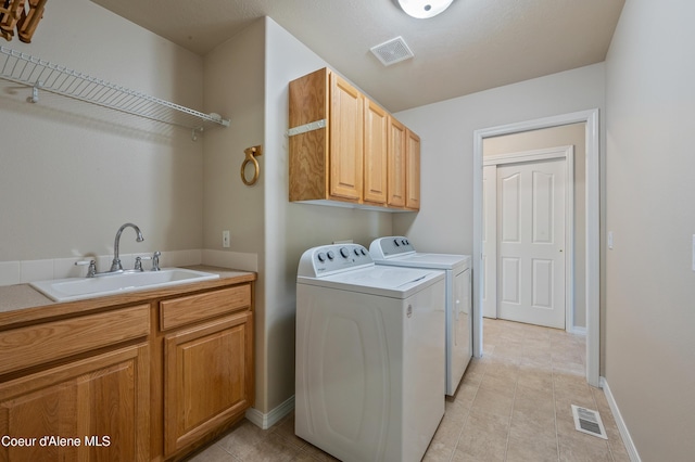 3749 N Miners Loop, Coeur Dalene, ID 83815 - laundry room with washing machine and clothes dryer, cabinet space, and light tile patterned floors