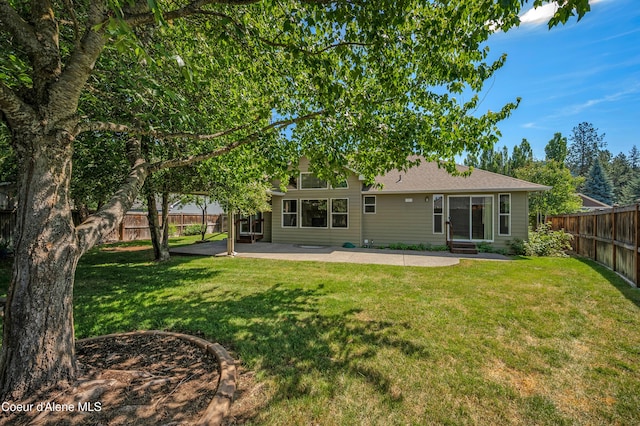 3749 N Miners Loop, Coeur Dalene, ID 83815 - back of property with a patio, a fenced backyard, and roof with shingles