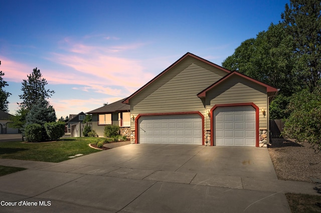3749 N Miners Loop, Coeur Dalene, ID 83815 - ranch-style house featuring concrete driveway, stone siding, a garage, and a front yard