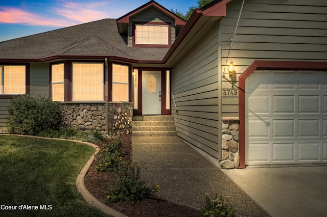 3749 N Miners Loop, Coeur Dalene, ID 83815 - view of front of home featuring a garage, a shingled roof, stone siding, driveway, and entry steps