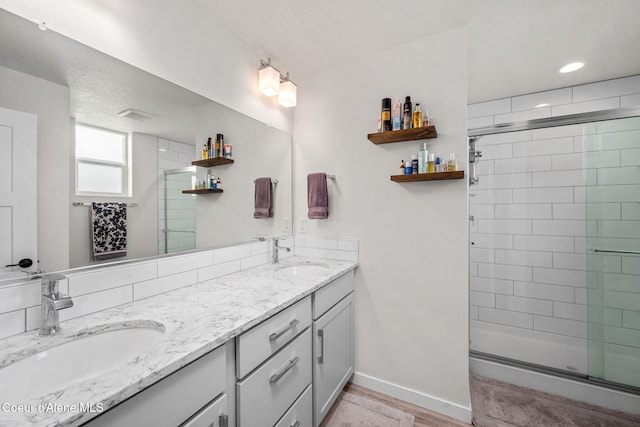 7991 N Girard Cir, Coeur Dalene, ID 83815 - full bathroom featuring a shower stall, double vanity, wood finished floors, and recessed lighting